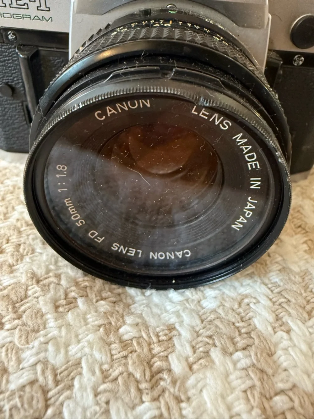 Canon AE-1 Film SLR Camera in Silver and Black with Lens